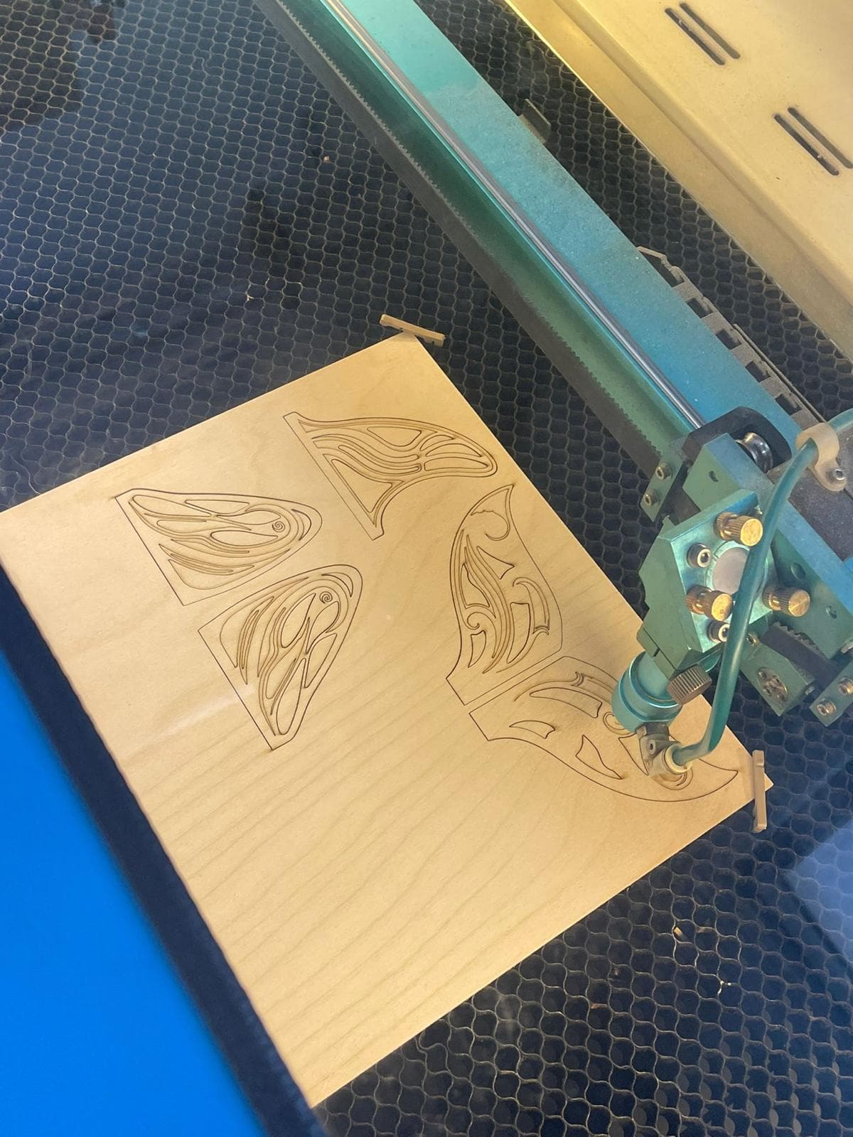 Laser cutter at Create Makerspace cutting Orcar fin panels from plywood